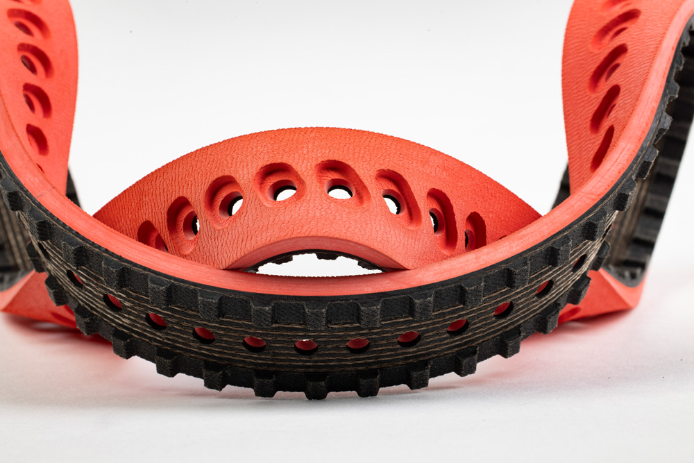 Courroie crantée avec revêtement